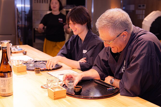 Japanese Sake Tasting & Wagyu Sukiyaki Cooking Class in Tokyo - Eating the finished sukiyaki with sake