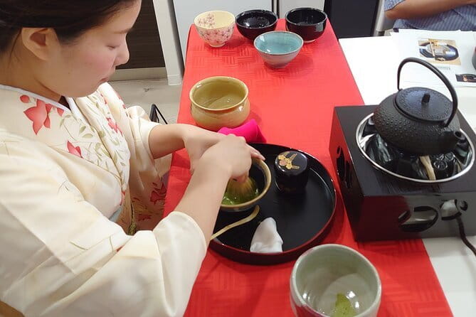 Osaka Cooking Class and Sake Tasting with Local Supermarket Visit - Making okonomiyaki on the griddle